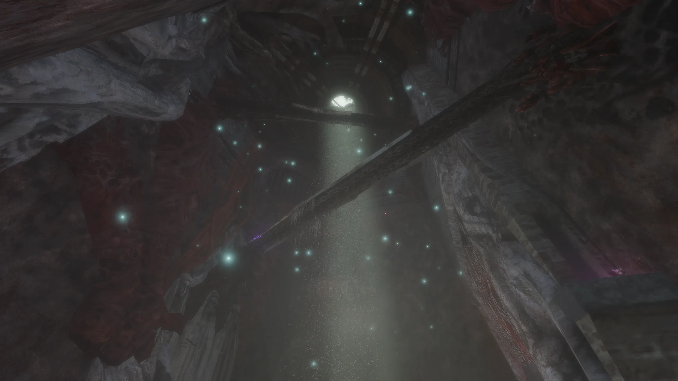 A starlit cavern lit by a single shaft of light